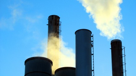Smoke billowing out of industrial chimneys